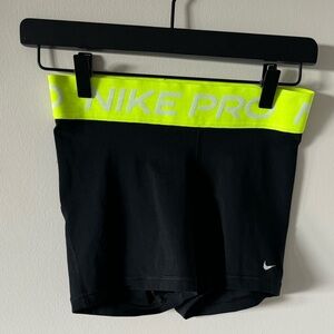 Black Nike Pros With A Neon Yellow Waistband; Size S